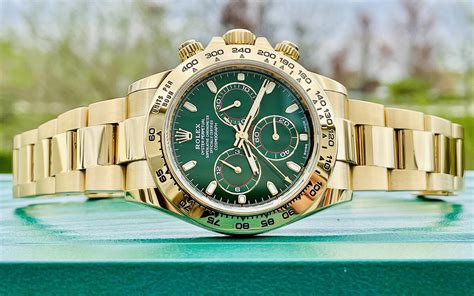 gold rolex with green face.